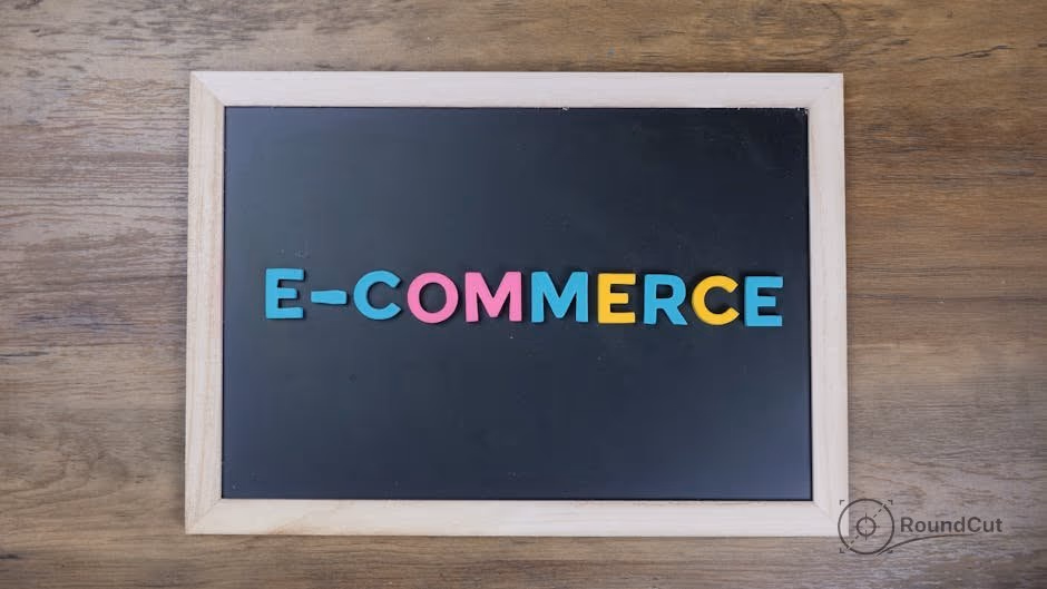 Colorful letters spelling 'e-commerce' on a wooden framed blackboard